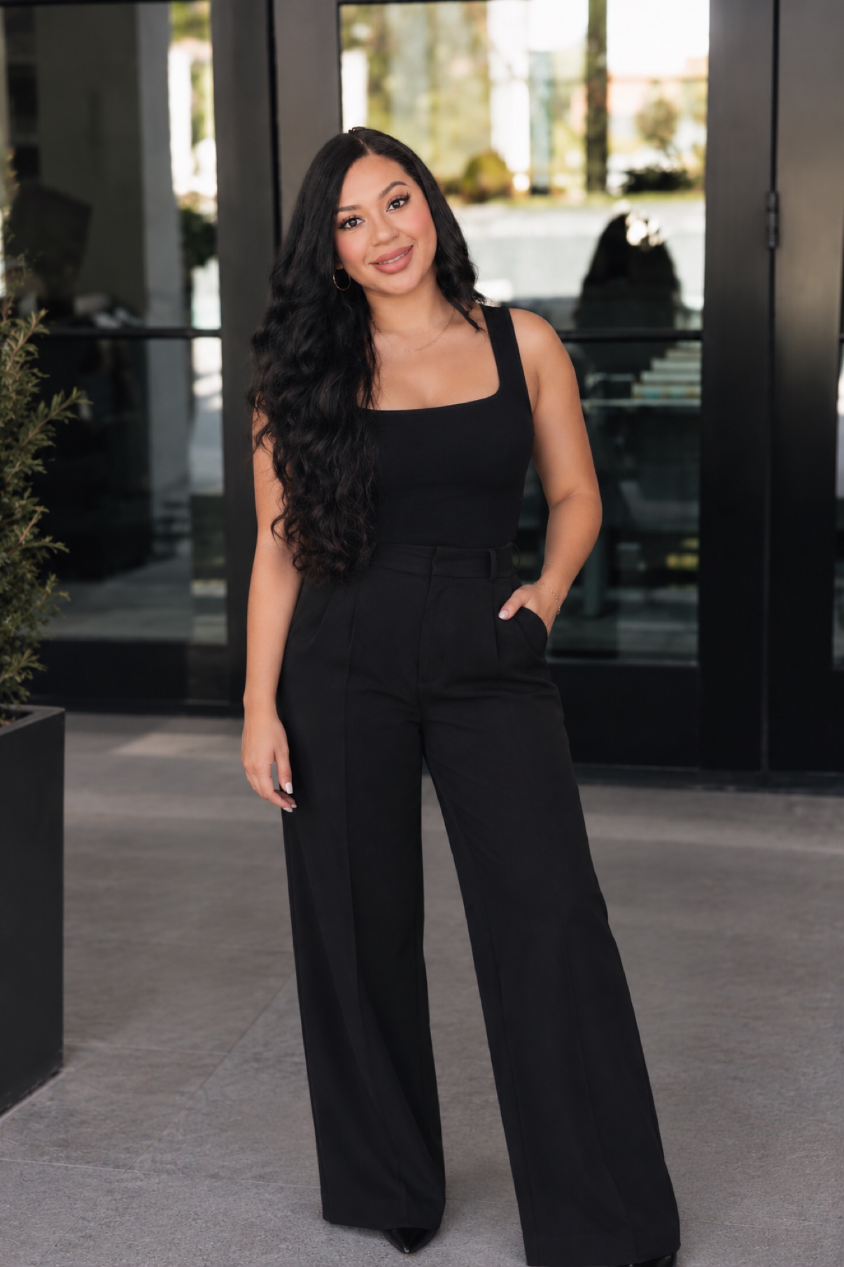 Brianna Trevino standing outside in a black outfit